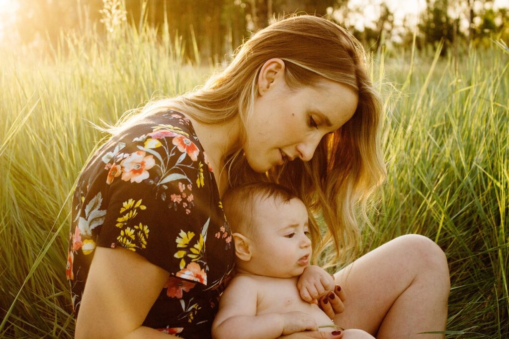 mother, baby, child, happy mothers day, field, motherhood, parent, parenthood, infant, family, girl, grass, love, woman, sit, sitting, outdoors, nature, portrait, golden light, mum, mom
